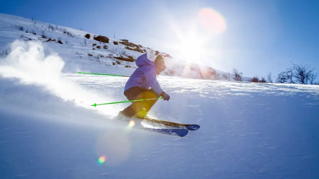 A man skiing on snow covered mountain