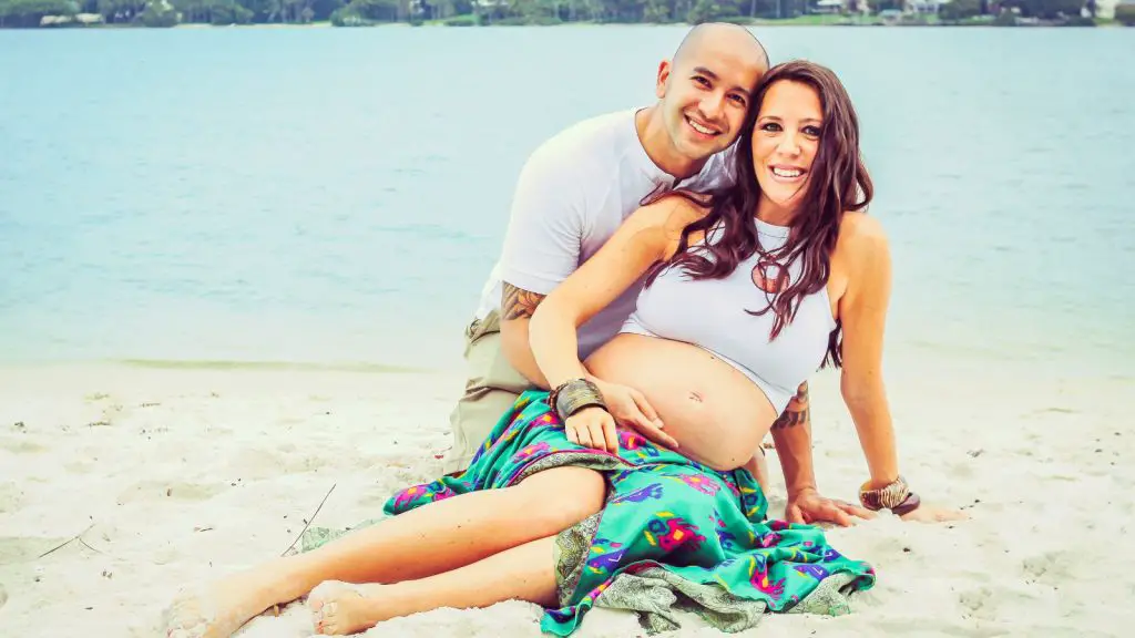 Happy expectant couple on their babymoon